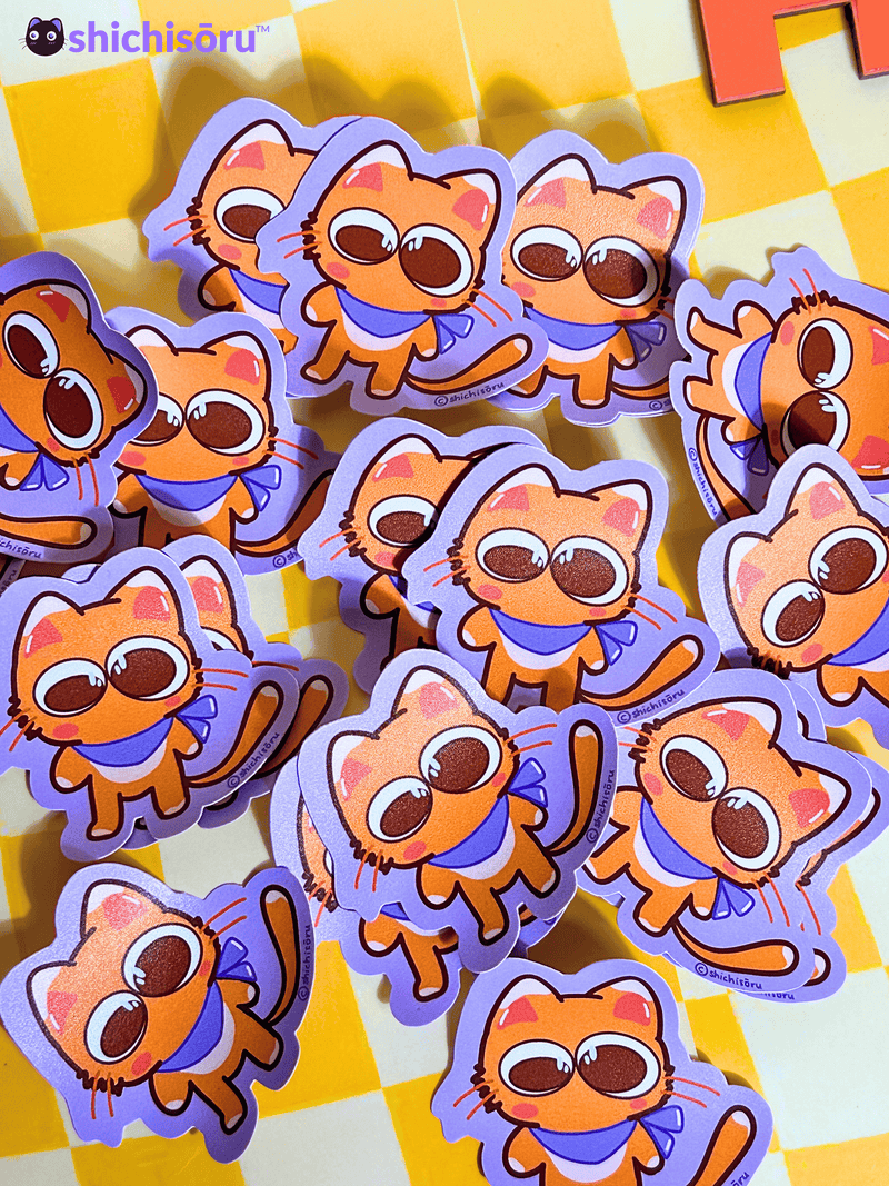 Stickers of cartoon cat characters on a checkered background
