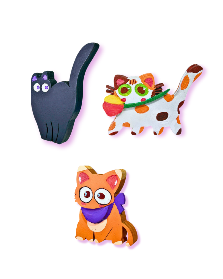 Three colorful cat-shaped toys on a white background